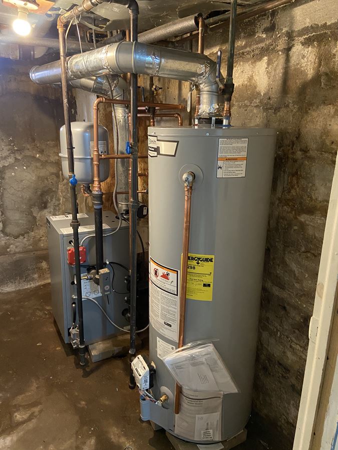 Alt=A boiler and a water heater that was installed in Deer Park.